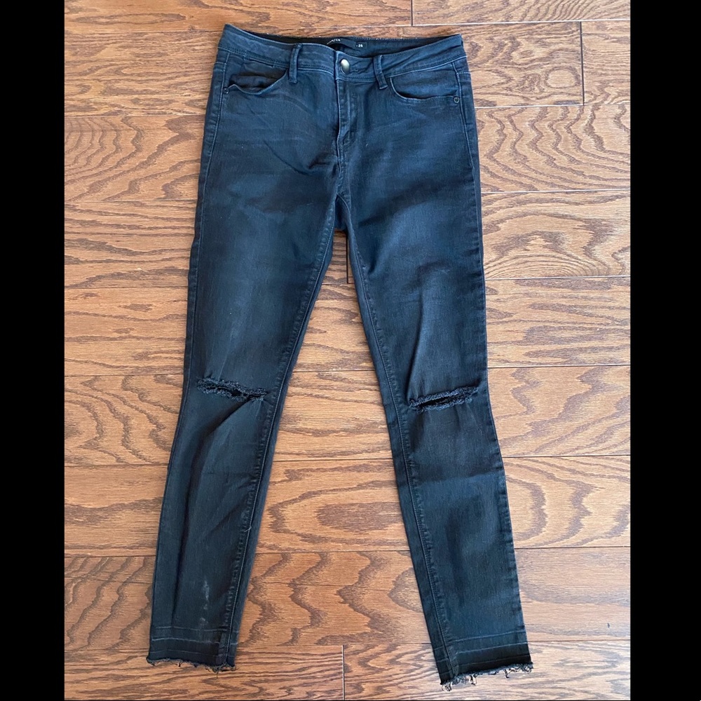 Francesca’s black ripped jeans